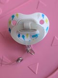 Pacifier badge reel