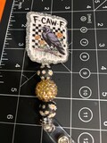 F Caw F badge reel