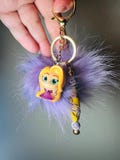 Rapunzal from Tangled purple fluffy keychain/bag charm with Pom Pom