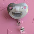 Pacifier badge reel